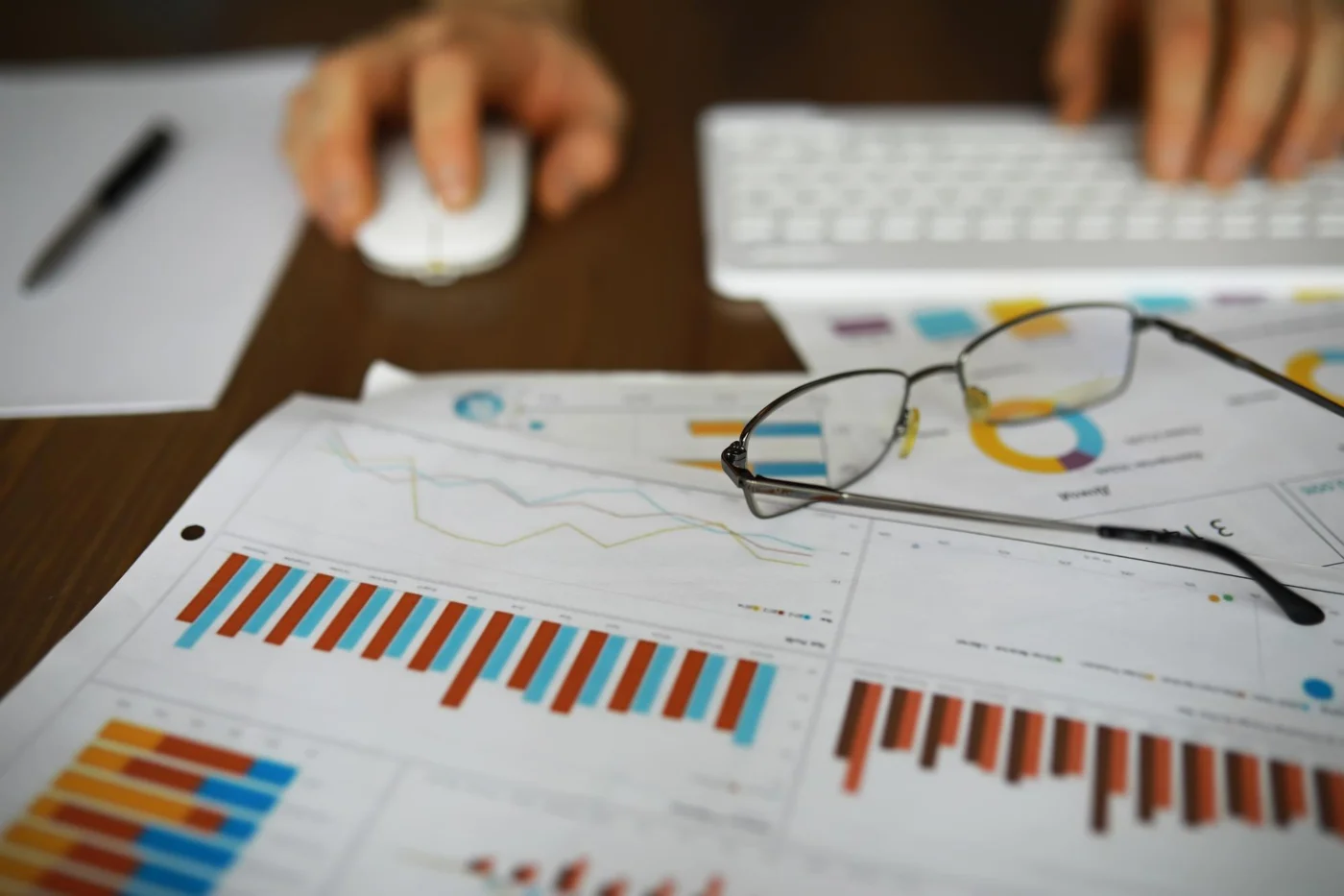 A financial analyst working with charts and reports