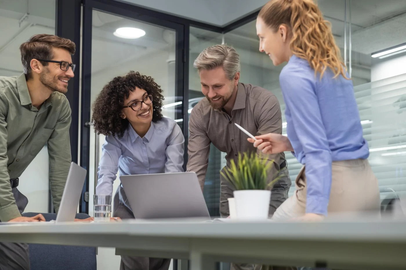 A friendly back-office team working together in a modern office