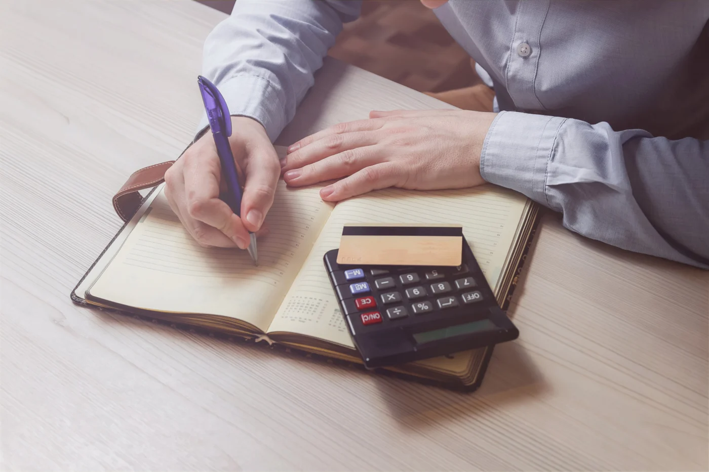 Calculating income tax with a calculator and notes