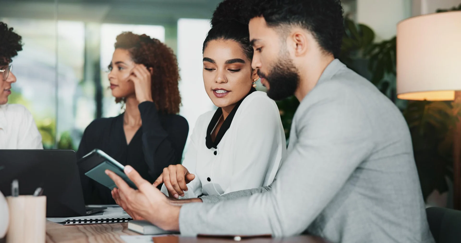 Business owners planning a relocation in a modern office