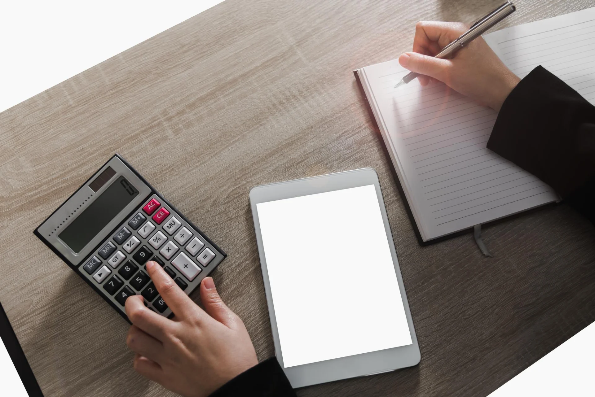 A business owner reviewing VAT paperwork at a desk
