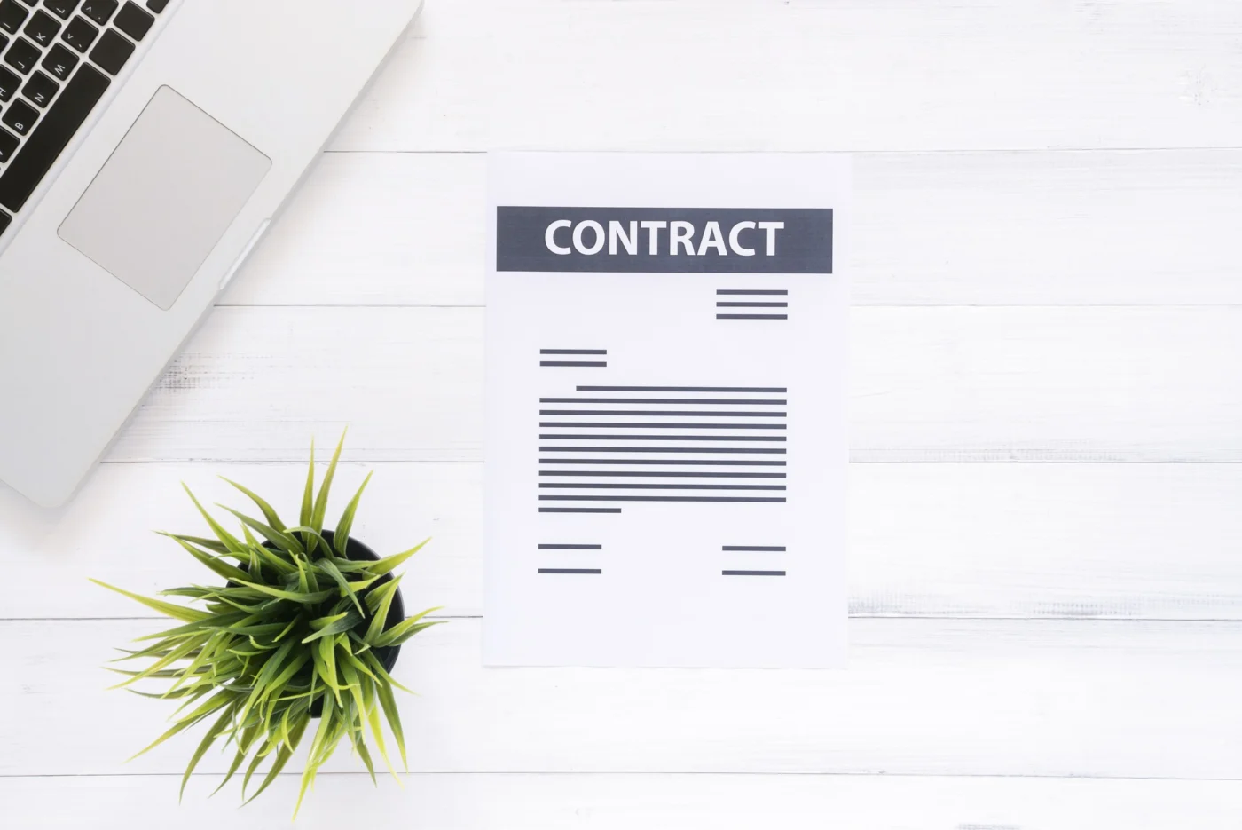 A company-formation document being signed on a tidy office desk