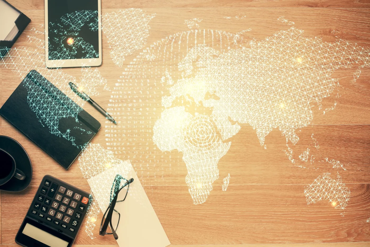 A globe beside international financial documents on an office desk