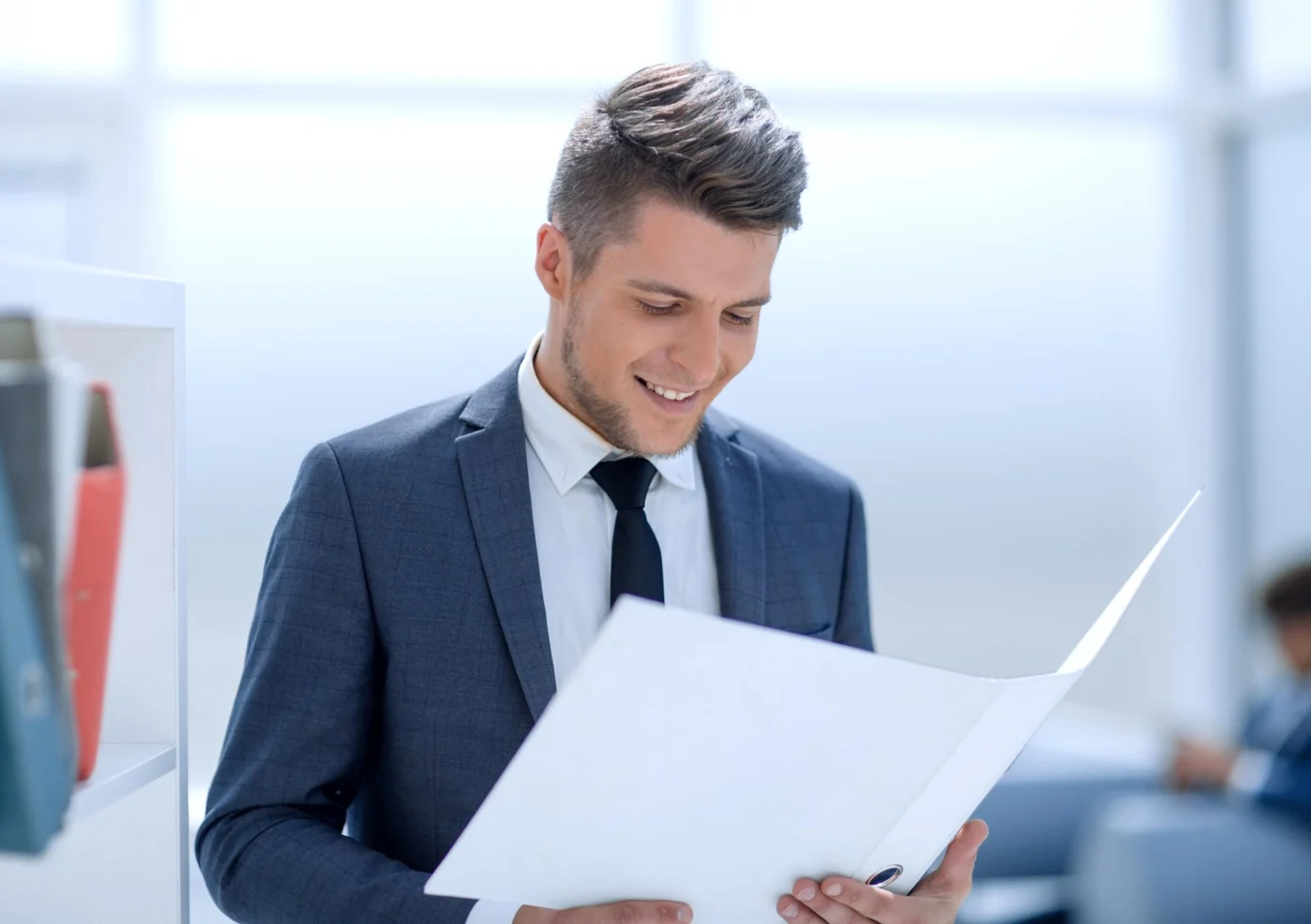A business owner reading compliance guidance at a desk