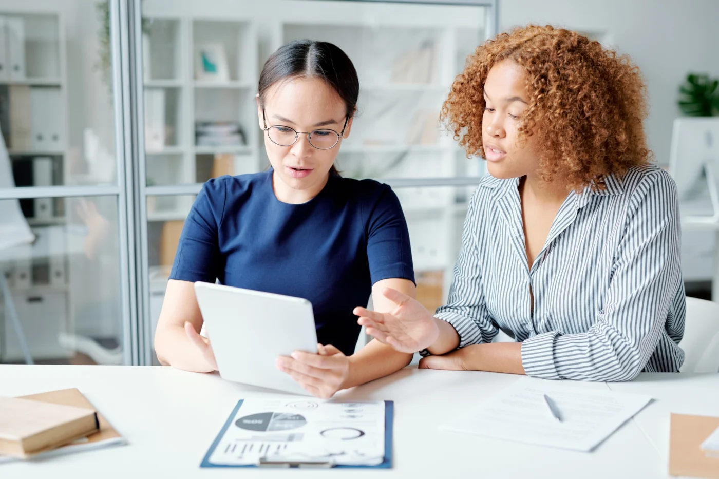 A director and accountant reviewing company accounts together
